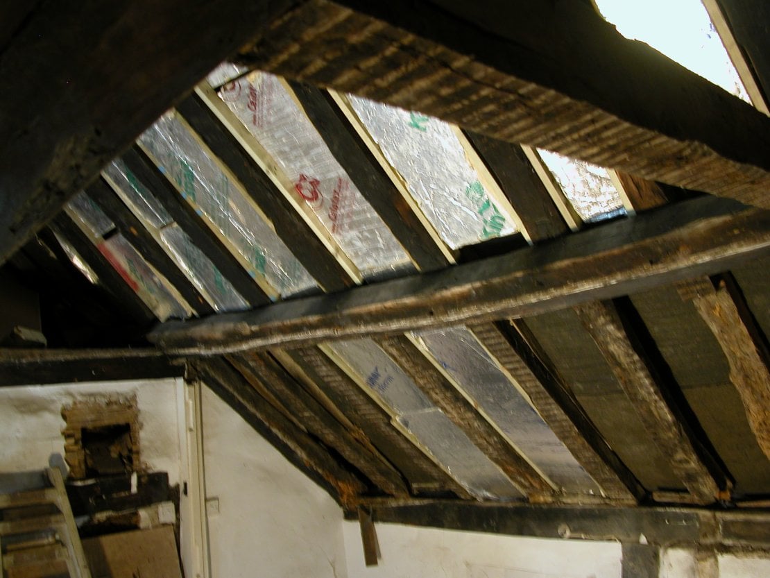 Tudor house roof beam in period home extensions