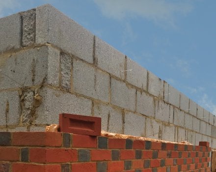 Can you use imperial size bricks with metric blocks when building a new cavity wall?