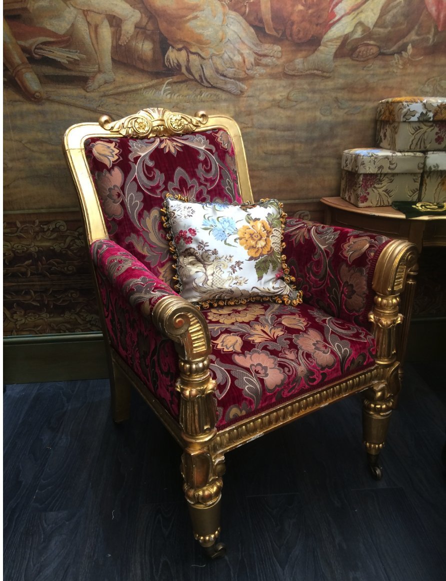 Ornate gold chair with wine coloured fabric