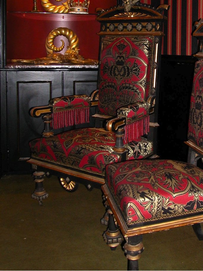 thrones with gold black and red fabric