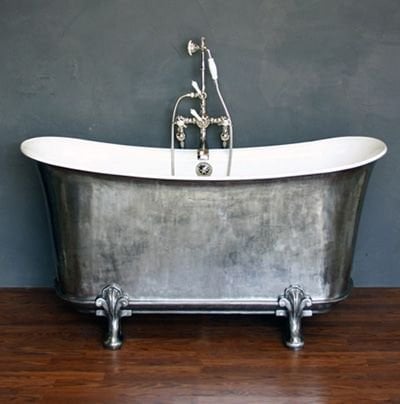 Cast iron bath with roll top edges